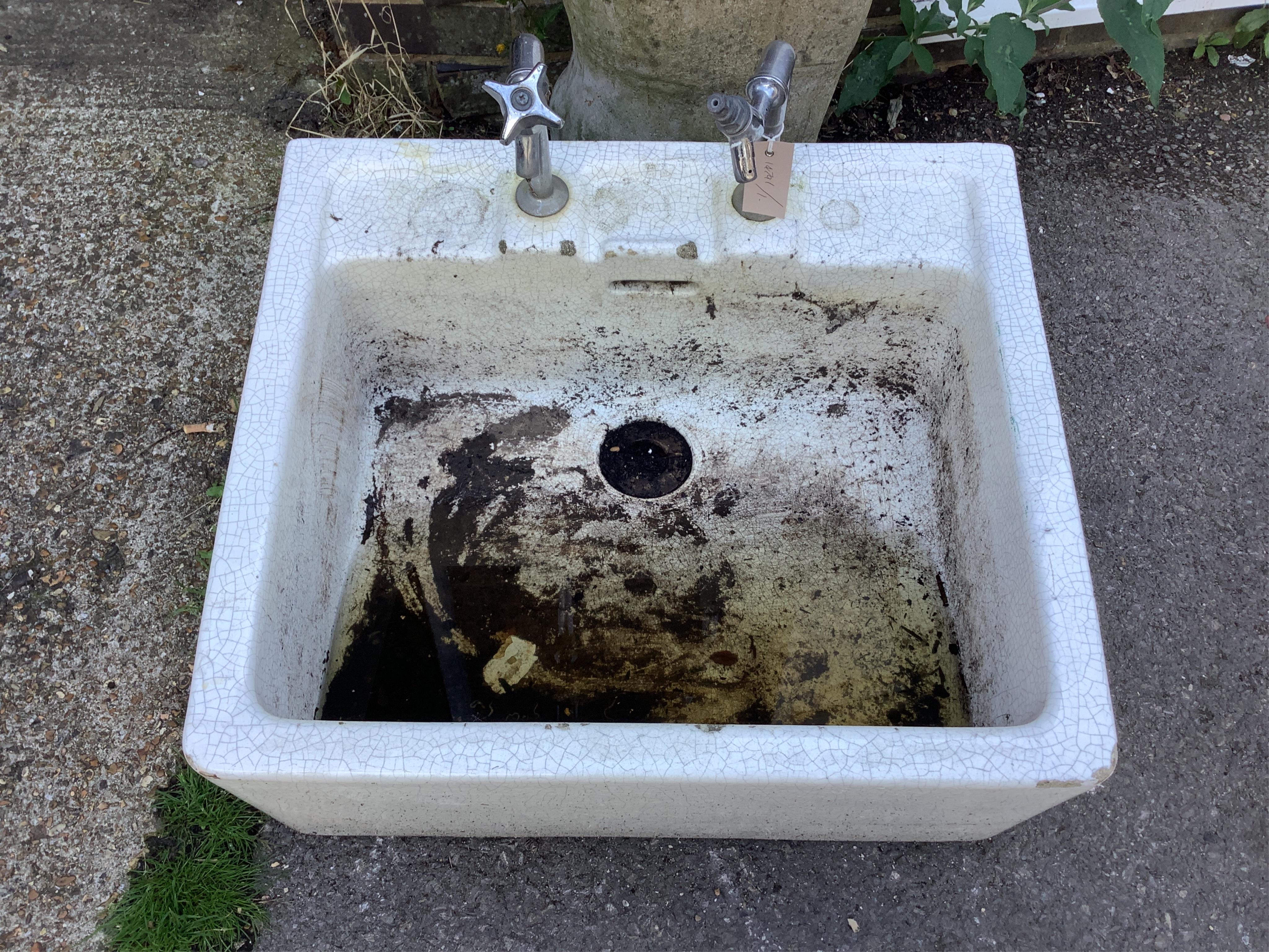 A rectangular enamelled sink, width 62cm, depth 56cm, height 28cm. Condition - fair